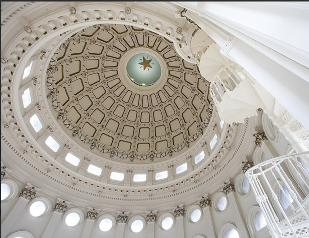 A view of a circular white ceiling at the Texas House of Representatives.
